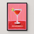 Framed artwork of a cosmopolitan cocktail with a pink background