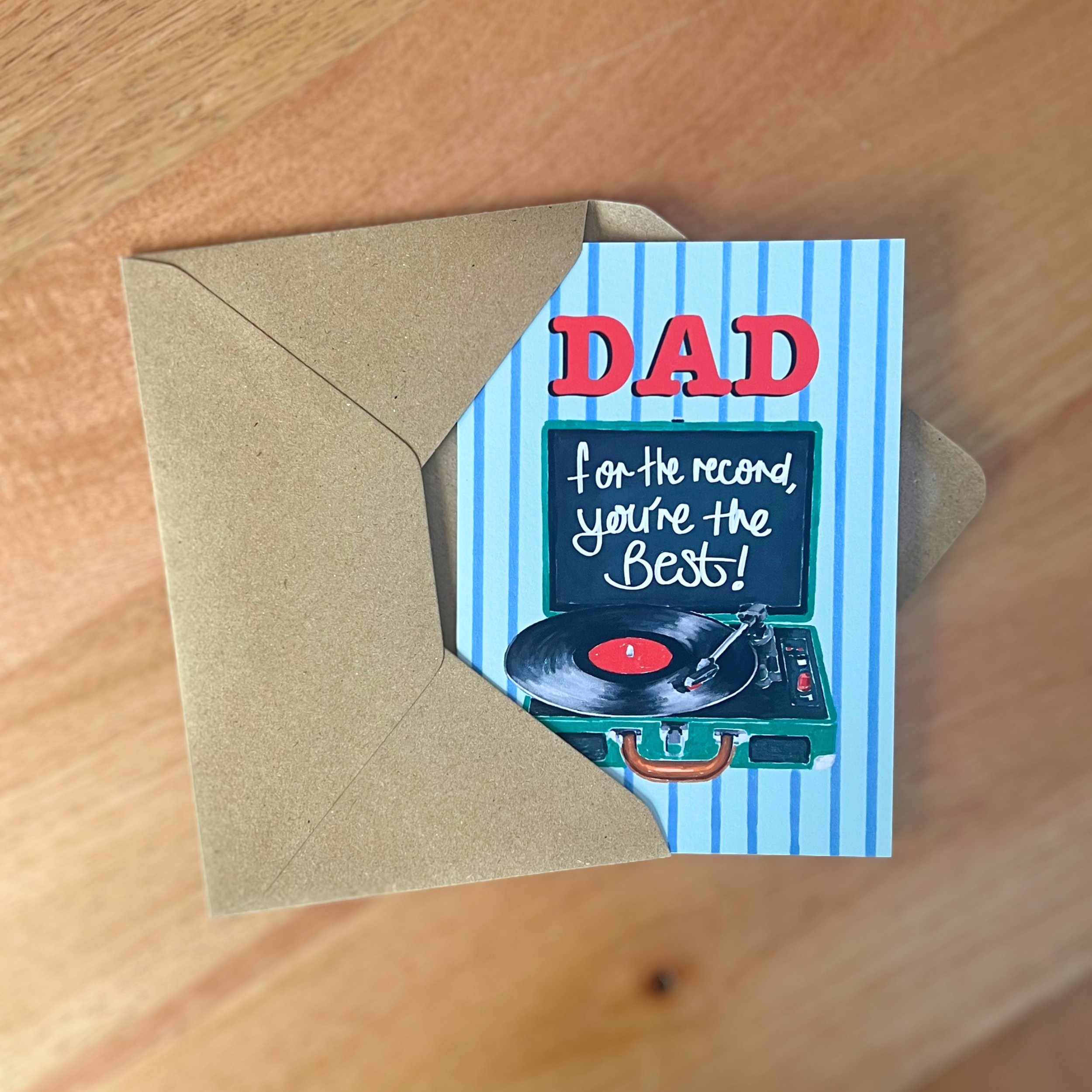 Greeting card for Dad with record player illustration on a wooden surface