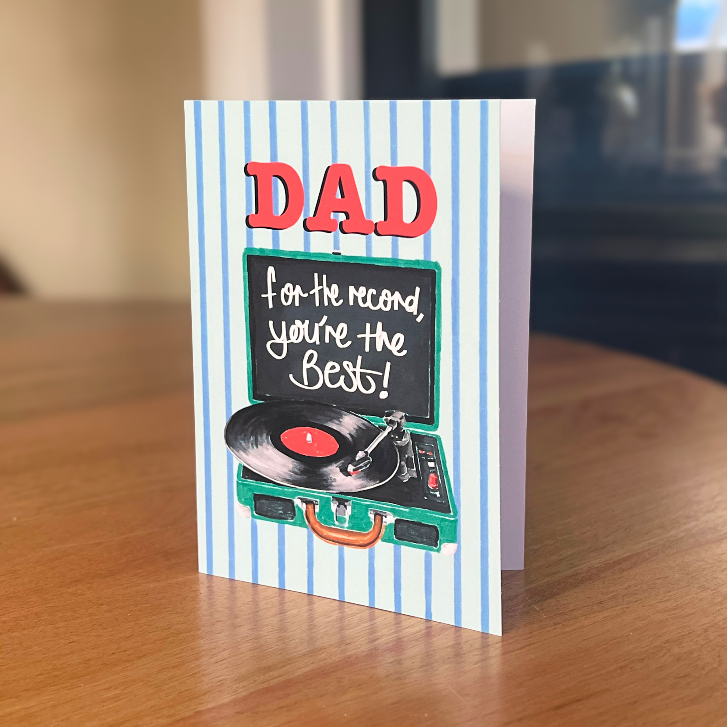 Greeting card for Dad with record player illustration on a wooden surface