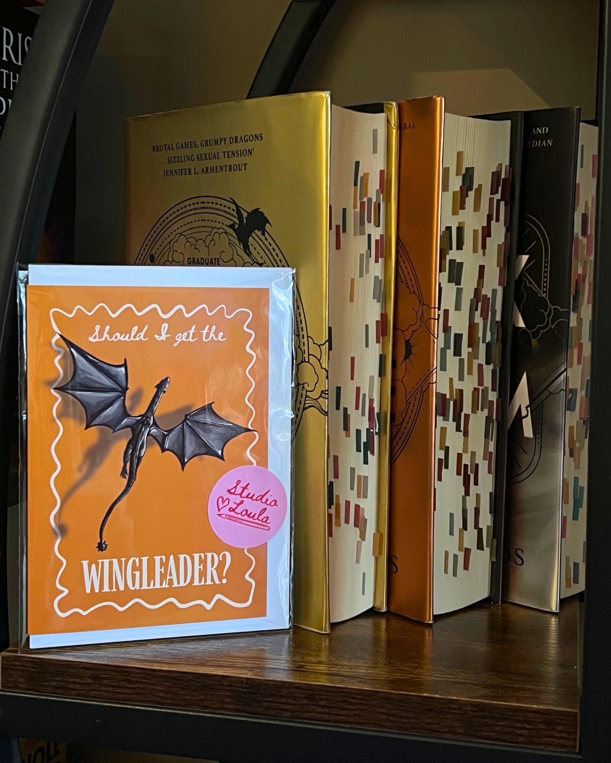 fourth wing inspired greeting card with dragon next to fourth wing book stack