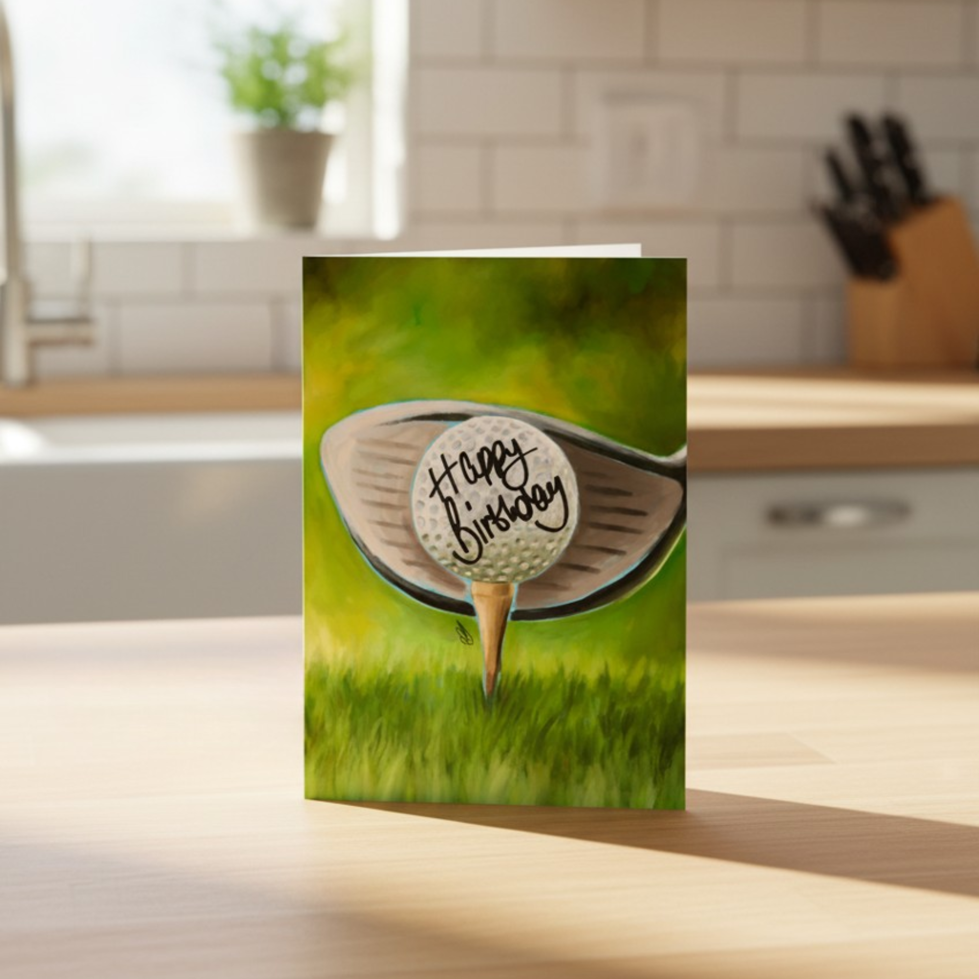 Greeting card with a golf ball and club on a grass background, featuring 'Happy Birthday' text.