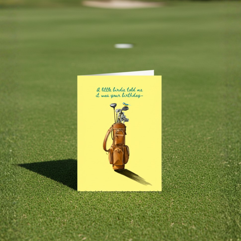 Birthday card with illustration of Golf bag with clubs on a yellow background with text 'A little birdie told me it was your birthday'. Displayed on a golf green.