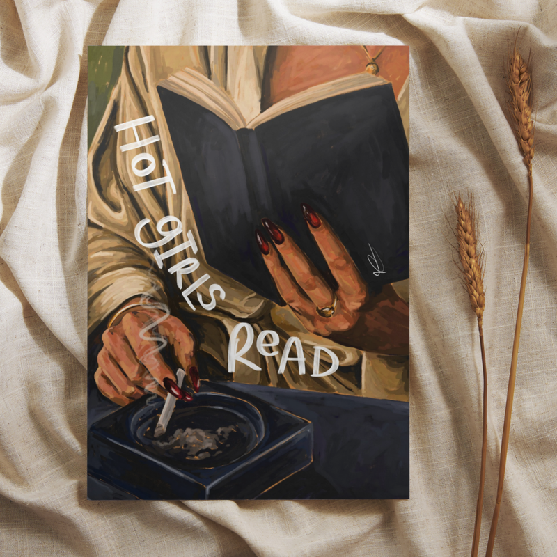 Art print of a woman reading whilst holding a cigarette with 'hot girls read' text, placed on a neutral background