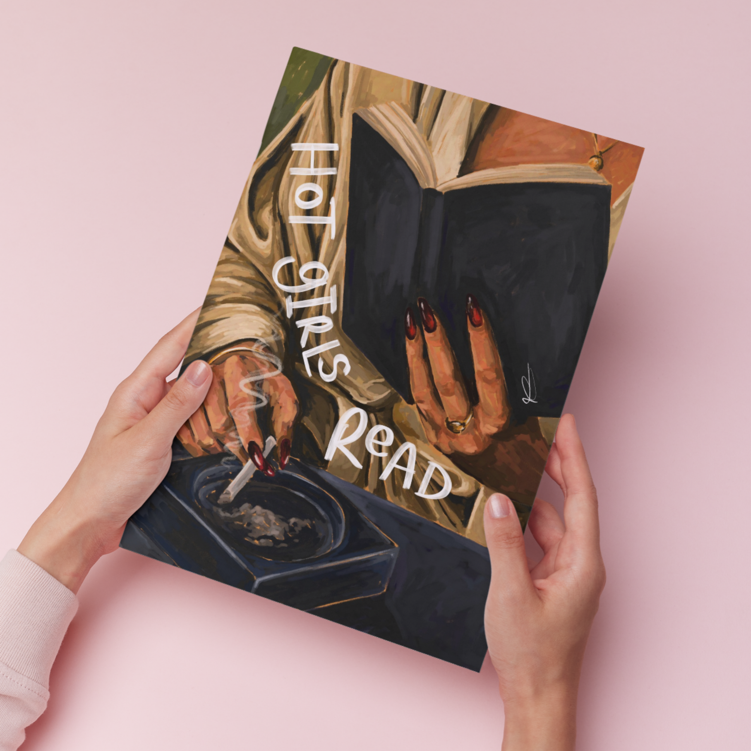 Art print of a woman reading whilst holding a cigarette with 'hot girls read' text, held against a pink background