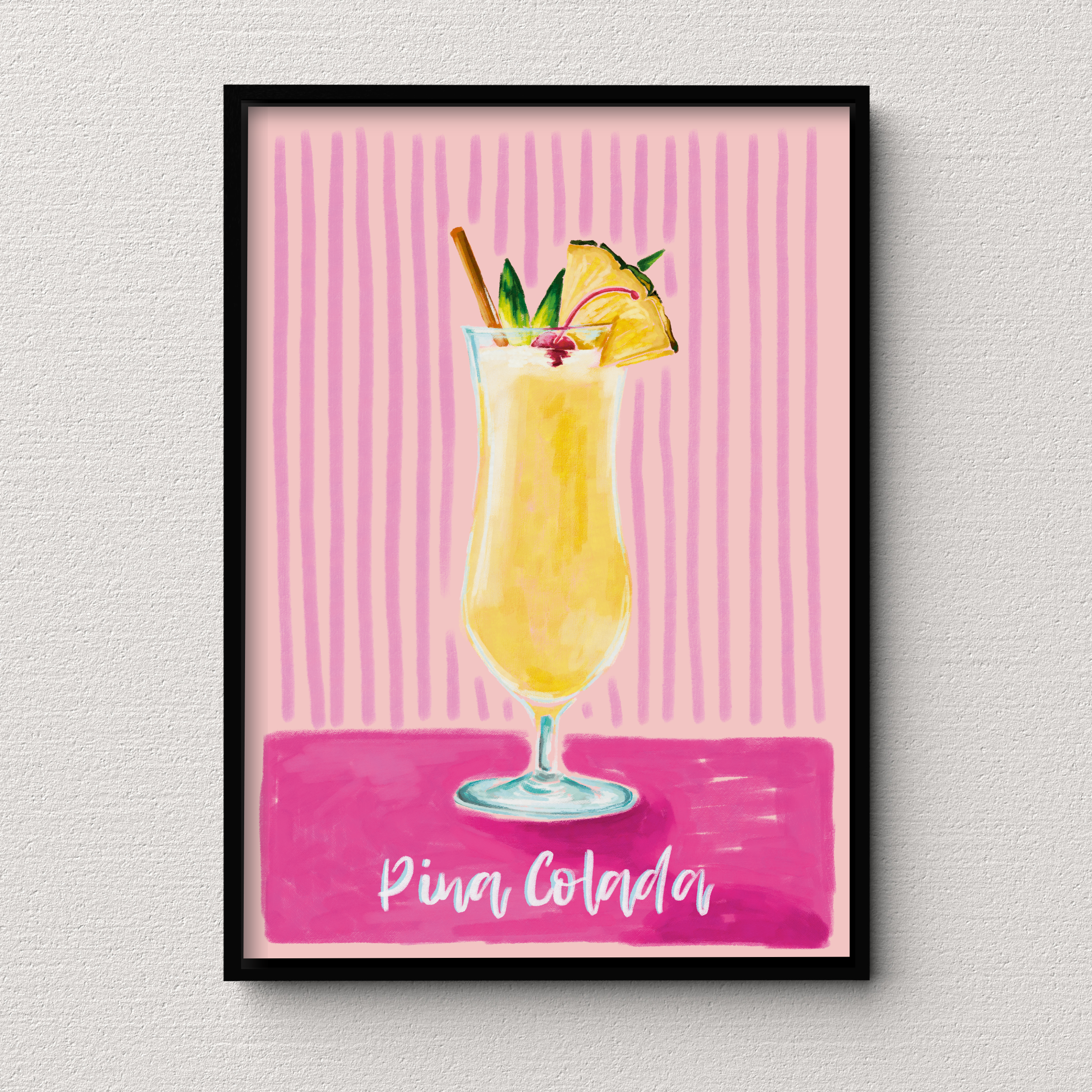 Framed artwork of a Pina Colada with pineapple slices and a straw on a pink background.