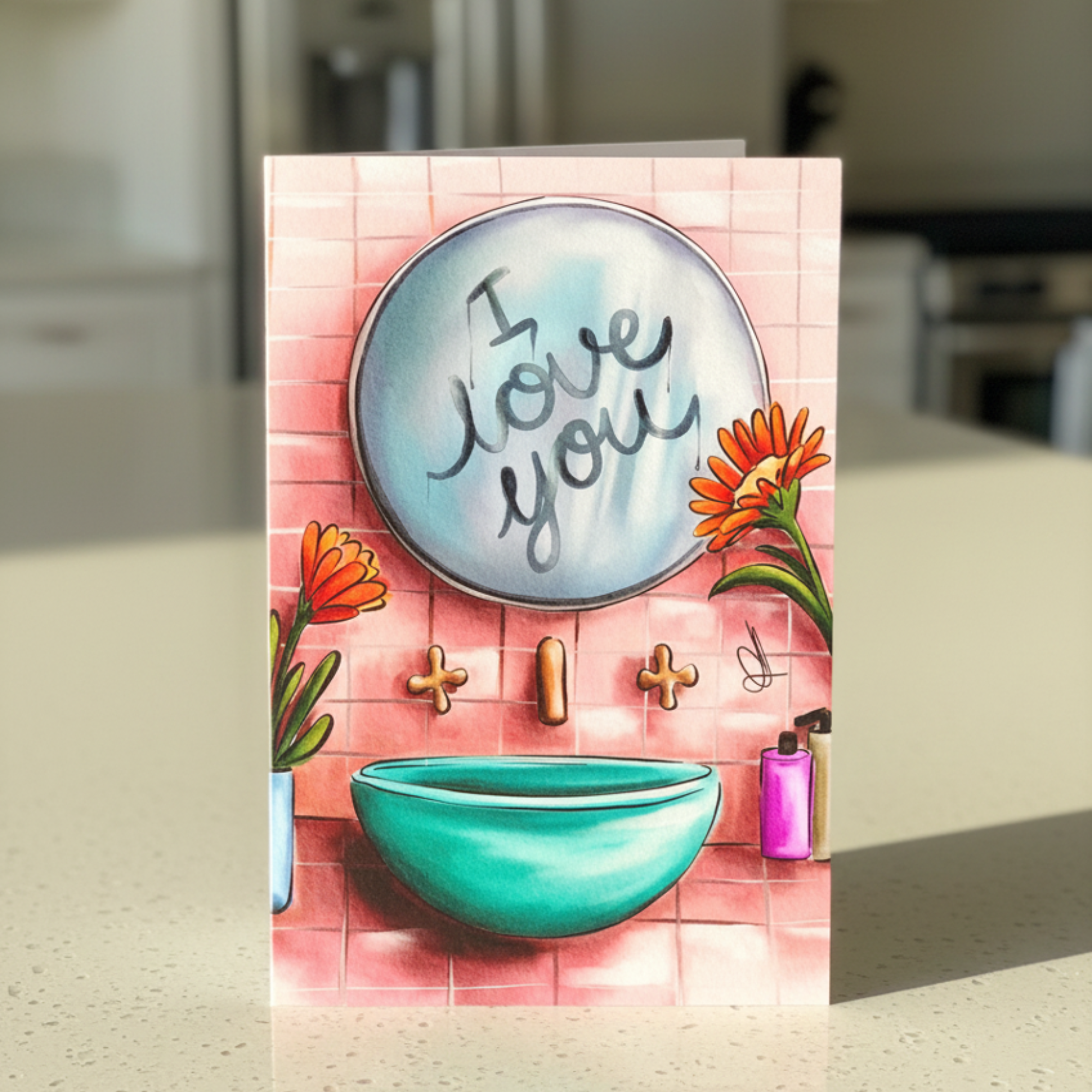 Greeting card with 'I love you' message written in a steamed bathroom mirror, placed on a kitchen counter.