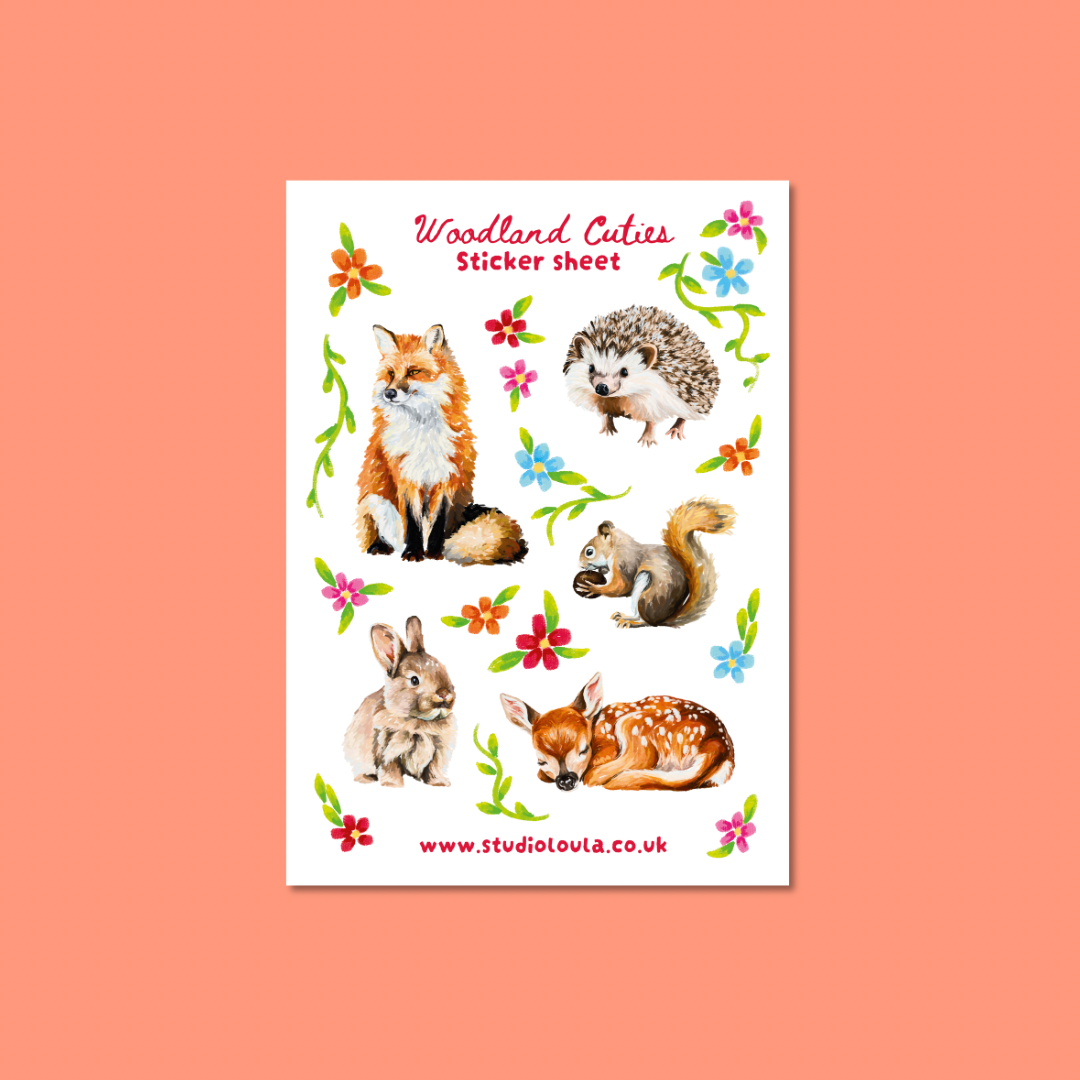 A white sticker sheet featuring watercolor illustrations of woodland animals, including a fox, hedgehog, squirrel, rabbit, and fawn, surrounded by colorful flowers and green leaves. The sheet is labeled 'Woodland Cutsies Sticker sheet' with the website 'www.