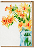 Greeting card with watercolor illustration of yellow daffodils in a blue vase on a white background.