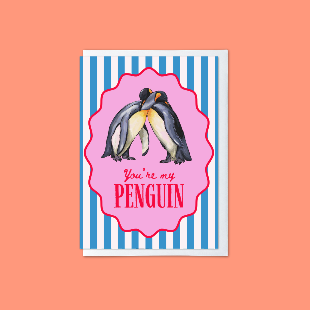 blue and white striped card with penguin hugging illustration in a pink frame and ‘you’ re my penguin’ message